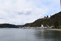 Sankt Goarshausen, Germany - 09 30 2021: Entry to Lorelei passage with passenger ship, waterfront of Sankt Goarshausen, Burg Katz