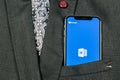Microsoft Word application icon on Apple iPhone X screen close-up in jacket pocket. Microsoft office word icon. Microsoft office o