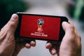 SANKT PETERSBURG, RUSSIA - APRIL 20, 2018: Closeup of iPhone screen with FIFA WORLDCUP 2018 LOGO in Russia