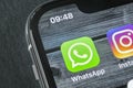 Whatsapp messenger application icon on Apple iPhone X smartphone screen close-up. Whatsapp messenger app icon. Social media icon. Royalty Free Stock Photo