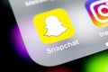 Snapchat application icon on Apple iPhone X smartphone screen close-up. Snapchat app icon. Social media icon. Social network