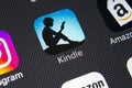 Amazon Kindle application icon on Apple iPhone X screen close-up. Amazon Kindle app icon. Amazon kindle application. Social media Royalty Free Stock Photo