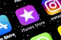 Apple iTunes store application icon on Apple iPhone X smartphone screen close-up. Mobile application icon of itunes store. Social