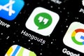 Google Hangouts application icon on Apple iPhone X smartphone screen close-up. Google hangouts app icon. Social network. Social me Royalty Free Stock Photo