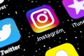 Instagram application icon on Apple iPhone X smartphone screen close-up. Instagram app icon. Social media icon. Social network Royalty Free Stock Photo