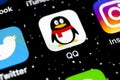 QQ messenger application icon on Apple iPhone X smartphone screen close-up. QQ messenger app icon. Social media network