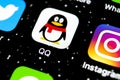 QQ messenger application icon on Apple iPhone X smartphone screen close-up. QQ messenger app icon. Social media network