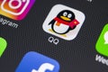 QQ messenger application icon on Apple iPhone X smartphone screen close-up. QQ messenger app icon. Social media network