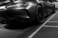 Mercedes-Benz AMG GTR 2018 V8 Bi-turbo exterior details. Back view. Car exterior details. Black and white.