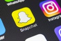 Snapchat application icon on Apple iPhone 8 smartphone screen close-up. Snapchat app icon. Snapchat is an online social networking Royalty Free Stock Photo