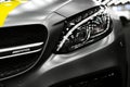 Side view of a Mercedes Benz C 63 s AMG coupe. Front Headlight .Car exterior details. AMG logo Royalty Free Stock Photo