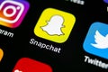 Snapchat application icon on Apple iPhone X smartphone screen close-up. Snapchat app icon. Social media icon. Social network Royalty Free Stock Photo