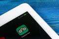 Tripadvisor application icon on Apple iPad Pro screen close-up. Tripadvisor.com app icon. Social media network. Social media app