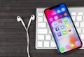 Apple iPhone X with icons of social media facebook, instagram, twitter, snapchat application on screen. Social media icons. Socia Royalty Free Stock Photo