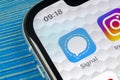 Signal messenger application icon on Apple iPhone X smartphone screen close-up. Signal messenger app icon. Social media network.