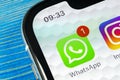 Whatsapp messenger application icon on Apple iPhone X smartphone screen close-up. Whatsapp messenger app icon. Social media icon.