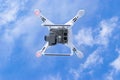 The New Aircraft DJI Phantom 4 pro quadcopter drone with 4K video camera and wireless remote controller flying in the sky. Aerial Royalty Free Stock Photo