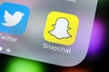 Snapchat application icon on Apple iPhone X smartphone screen close-up. Snapchat app icon. Social media icon. Social network Royalty Free Stock Photo