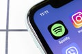 Spotify app icon on Apple iPhone 11 smartphone screen closeup. Spotify logo application on modern phone