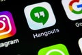 Google Hangouts application icon on Apple iPhone X smartphone screen close-up. Google hangouts app icon. Social network. Social me Royalty Free Stock Photo