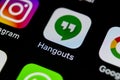 Google Hangouts application icon on Apple iPhone X smartphone screen close-up. Google hangouts app icon. Social network. Social me Royalty Free Stock Photo