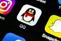 QQ messenger application icon on Apple iPhone X smartphone screen close-up. QQ messenger app icon. Social media network