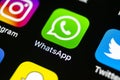 Whatsapp messenger application icon on Apple iPhone X smartphone screen close-up. Whatsapp messenger app icon. Social media icon. Royalty Free Stock Photo