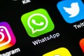 Whatsapp messenger application icon on Apple iPhone X smartphone screen close-up. Whatsapp messenger app icon. Social media icon. Royalty Free Stock Photo