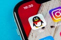 QQ messenger application icon on Apple iPhone X smartphone screen close-up. QQ messenger app icon. Social media network