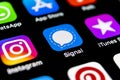 Signal messenger application icon on Apple iPhone X smartphone screen close-up. Signal messenger app icon. Social media network.