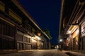 Sannomachi Street with buildings on it surrounded by lights during the night in Takayama, Japan
