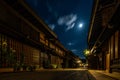 Sannomachi Street with buildings on it surrounded by lights during the night in Takayama, Japan