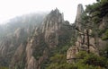 Sanqingshan Mountain in Jiangxi Province, China. Misty mountain scenery with rocky peaks on Mount Sanqing Royalty Free Stock Photo