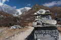 Sanskrit mantra rock carving leading Langtang Lirung Royalty Free Stock Photo