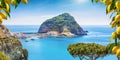 Sant`Angelo village, giant green rock in blue sea near Ischia Island, Italy Royalty Free Stock Photo