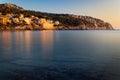 Sant Elm coastline, sunset,mediterranean sea, clear blue water,rocks, golden sunlight, hills, trees, near Sa Dragonera nature park