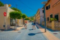 SANT ELM, MALLORCA, SPAIN - AUGUST 18 2017: Unidentified people walking at Sant Elm City, quaint shopping street in the