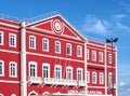 Santa Apolonia station in Lisbon hosting The Editory Riverside Hotel with a shining red facade Royalty Free Stock Photo