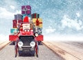 Santa arriving from sky with car full of Christmas presents Royalty Free Stock Photo