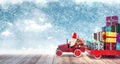 Santa arriving from sky with car full of Christmas presents Royalty Free Stock Photo