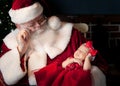 Santa and baby sleeping Royalty Free Stock Photo