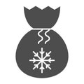 Santa bag solid icon. Present bag with snoflake vector illustration isolated on white. Christmas bag glyph style design