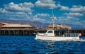 Fishing Boat Cruising Past Pier Royalty Free Stock Photo