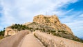 Santa Barbara Castle and pathway on fortification wall on Benacantil hill in Alicante, Spain. Neighborhood El Barrio or