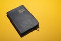 Santa Biblia Holy Bible in spanish over mustard yellow desk Royalty Free Stock Photo