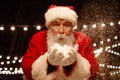 Santa Blowing Snow Out Royalty Free Stock Photo