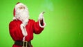 Santa blowing up a petard. chroma key. slow motion