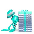 Santa bot leaning on the gift box in white background Royalty Free Stock Photo