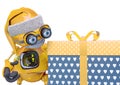 Santa bot beside and looking the gift box in white background Royalty Free Stock Photo