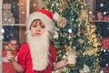 Christmas kids in snow. Santa boy child eating cookies and drinking milk. Christmas cookies and milk. Christmas child Royalty Free Stock Photo